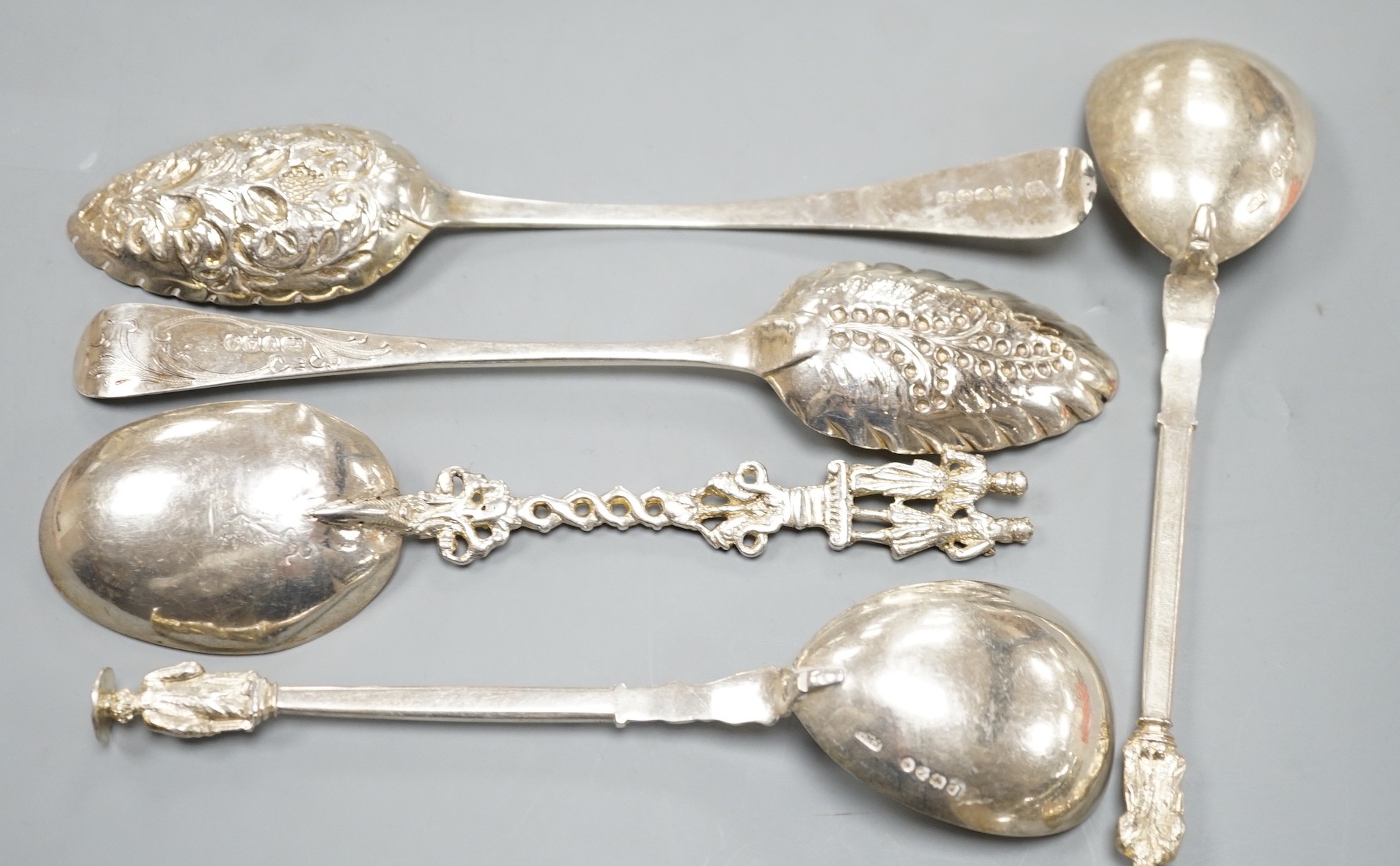 Two George III silver 'berry spoons', a pair of Victorian silver apostle serving spoons, Josiah Williams & Co, London, 1888, 19.8cm and a continental white metal spoon.